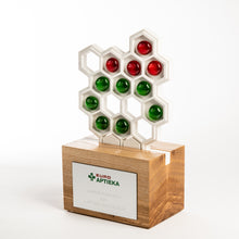 Load image into Gallery viewer, 3D cut custom award produced from oak wood and Meganite solid surface supplemented with glass nuggets_custom design