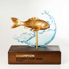 Load image into Gallery viewer, Gold fish trophy with water design on a wooden base, labeled 'Champion Roomy Cup 2025