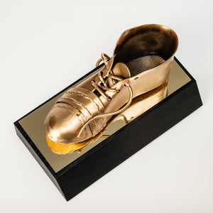 Golden football shoe trophy