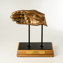 Load image into Gallery viewer, Bronze hand sculpture on a wooden base with a white background